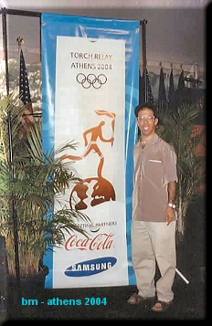 Mike next to olympic banner