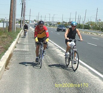Couple of cyclist passing Mike