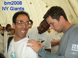 Two Giants player sign Mike's shirt in the practice bubble in Sept 2008