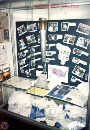 The olmypic items and the 2002 olympic torch displayed at the Belleville Library